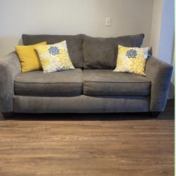 Grey Sofa With Decorative Pillows 