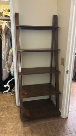 Standing brown wood shelf. Approx 6” tall.