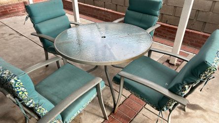 Glass table with 4 chairs