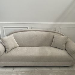 Off white Solid wood custom made sofa. With two toss pillows.