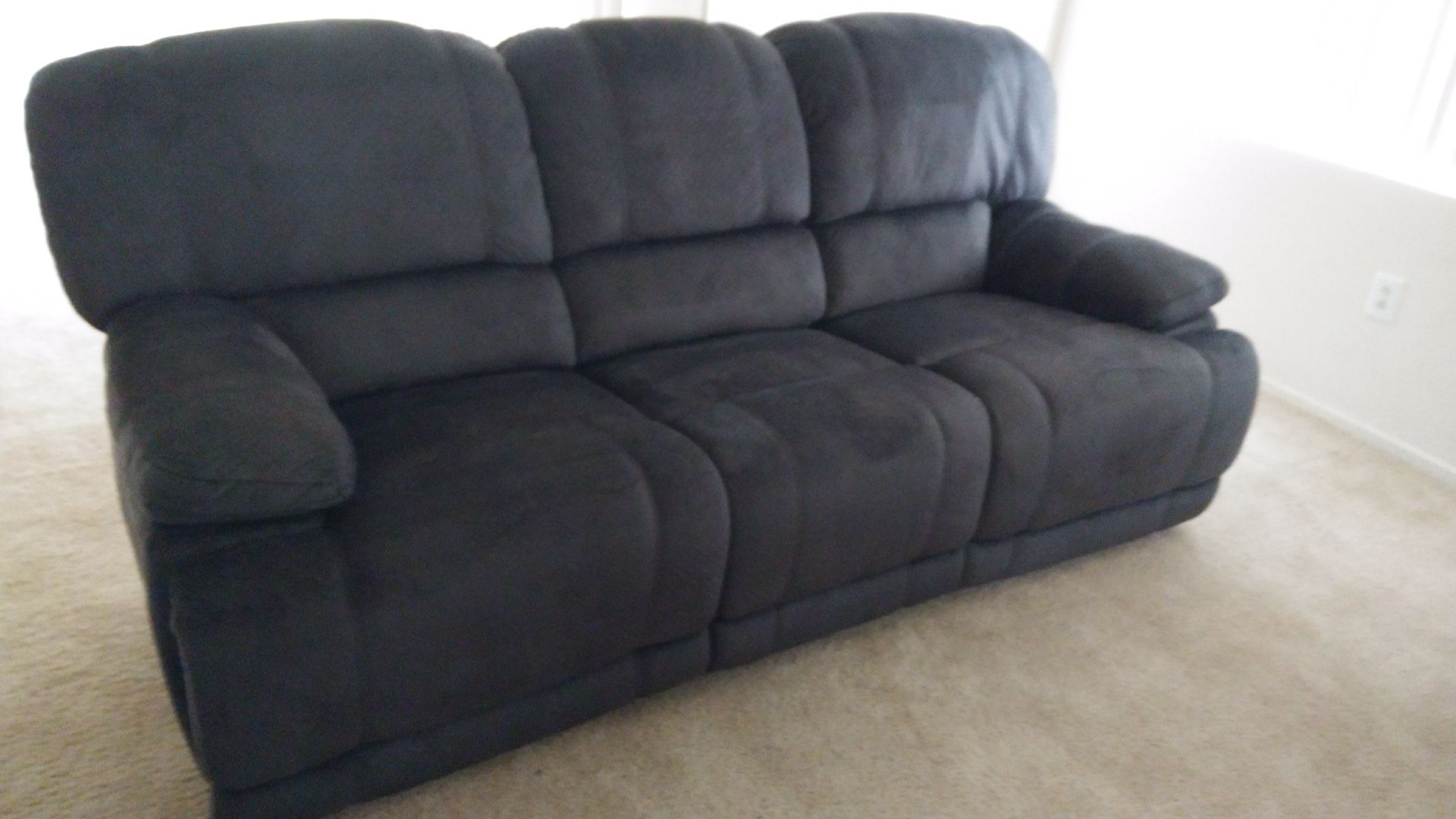 Couch with 2 built in recliners. Barely used