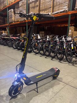 Front and rear shock-absorbing electric scooters