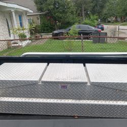 Toolbox for truck and back windshield  guard. The toolbox needs a key made for it... 