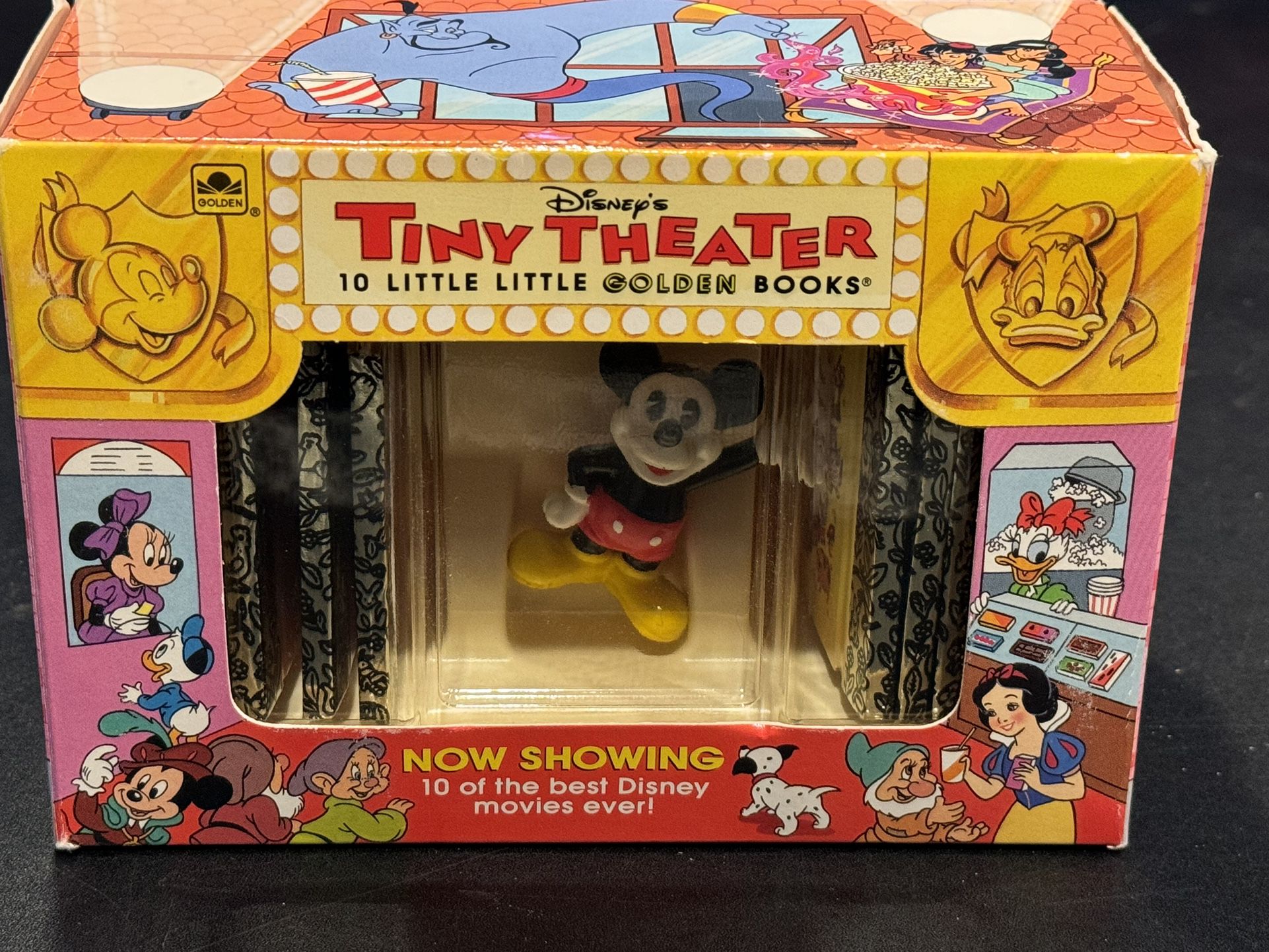  The product is a 1993 Disney's Tiny Theatre set that includes 10 Little Golden Books and a Mickey Mouse figure. The figure is part of the Mickey & Fr