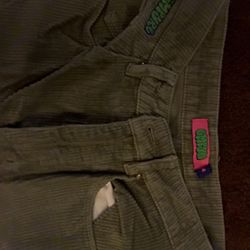Olive green corduroy pants with a relaxed fit 