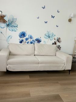 Modern high leg sofa.