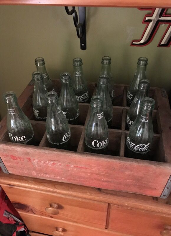 Coke bottles and antique case