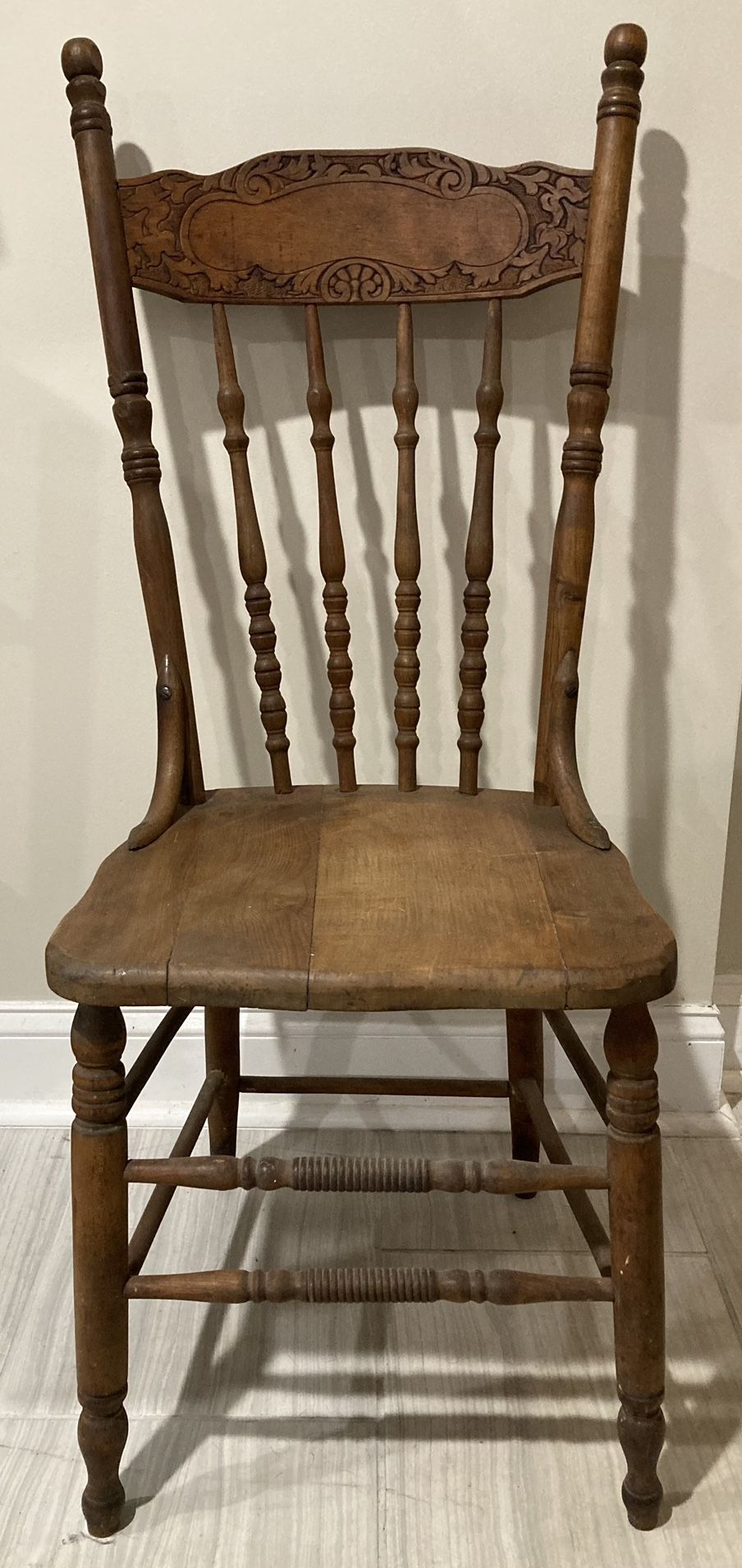 A beautiful Antique carved wood chair with solid wood seat