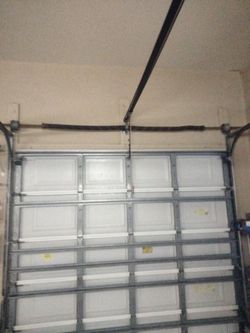 Garage Door Broken Spring Opener Off Track Adjustment Replace And Parts