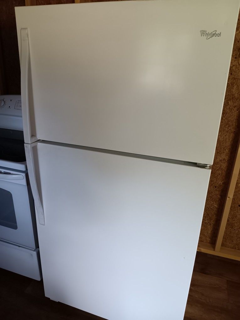 White GE Flattop Range and Whirlpool Refrigerator Freezerl