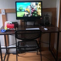 Dell touchscreen desktop with wireless Apple keyboard and Apple mouse