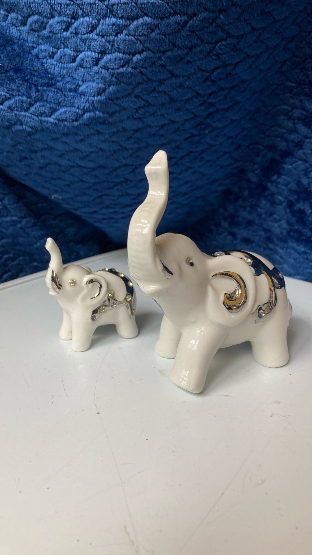 Two ceramic elephant figurines