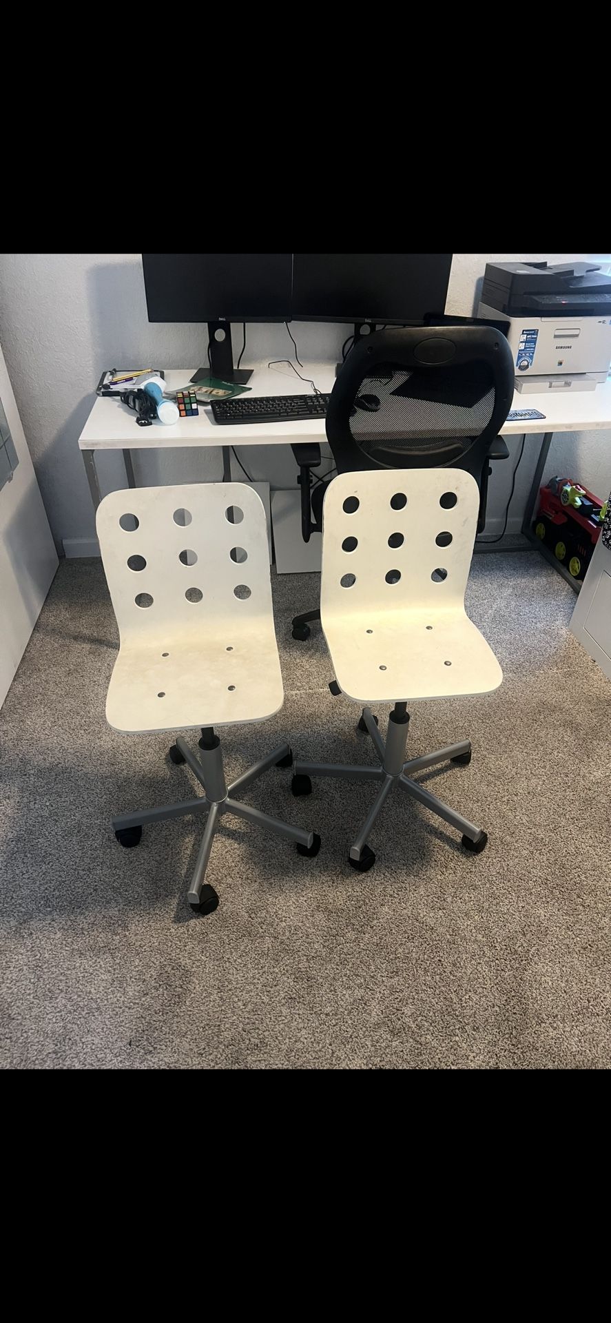 2 white Ikea chairs for kids