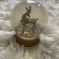gold reindeer snow globe