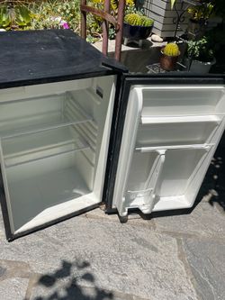 Mini fridge. Roughly 31 inches tall by 18inches wide.