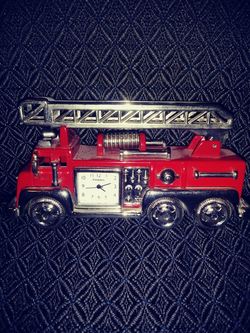 Miniature firetruck fossil clock