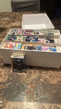 Got a whole box filled with Naruto cards and a chunk of Pokémon cards