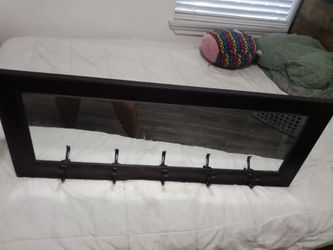 Mirror with hooks