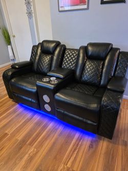 Power reclining sofa and loveseat with music speakers and reading lights