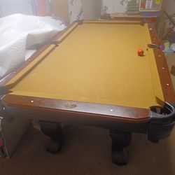 Pool Table And Motor Cycle