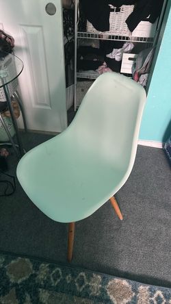 White chair with wooden legs