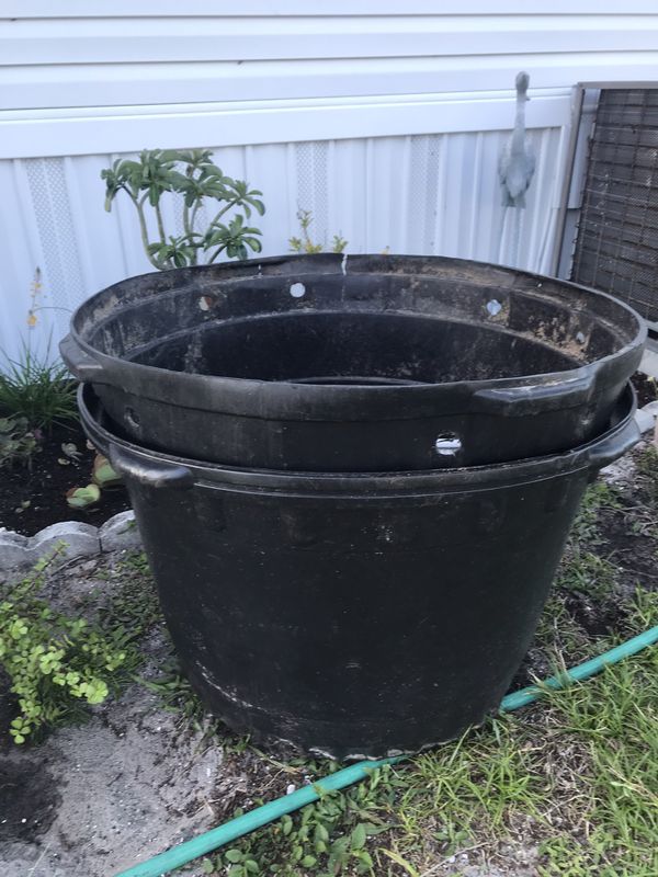 2 GIGANTIC. 50 gallon plastic plant pots for Sale in Hobe