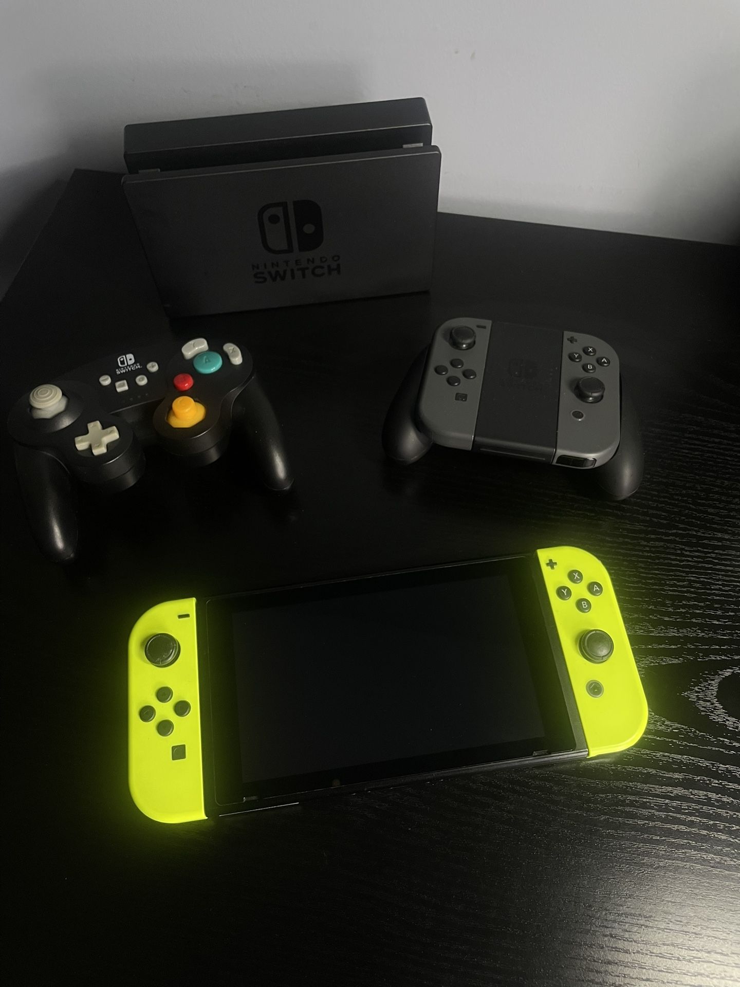 Nintendo Switch 32GB Console Black with Neon Yellow Joy Cons, Dock, Grip (with Grey Joy Cons) & Power A GameCube Style Wireless Controller