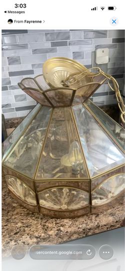 Beautiful vintage 1970s/1980s brass and glass hanging chandelier light fixture.
