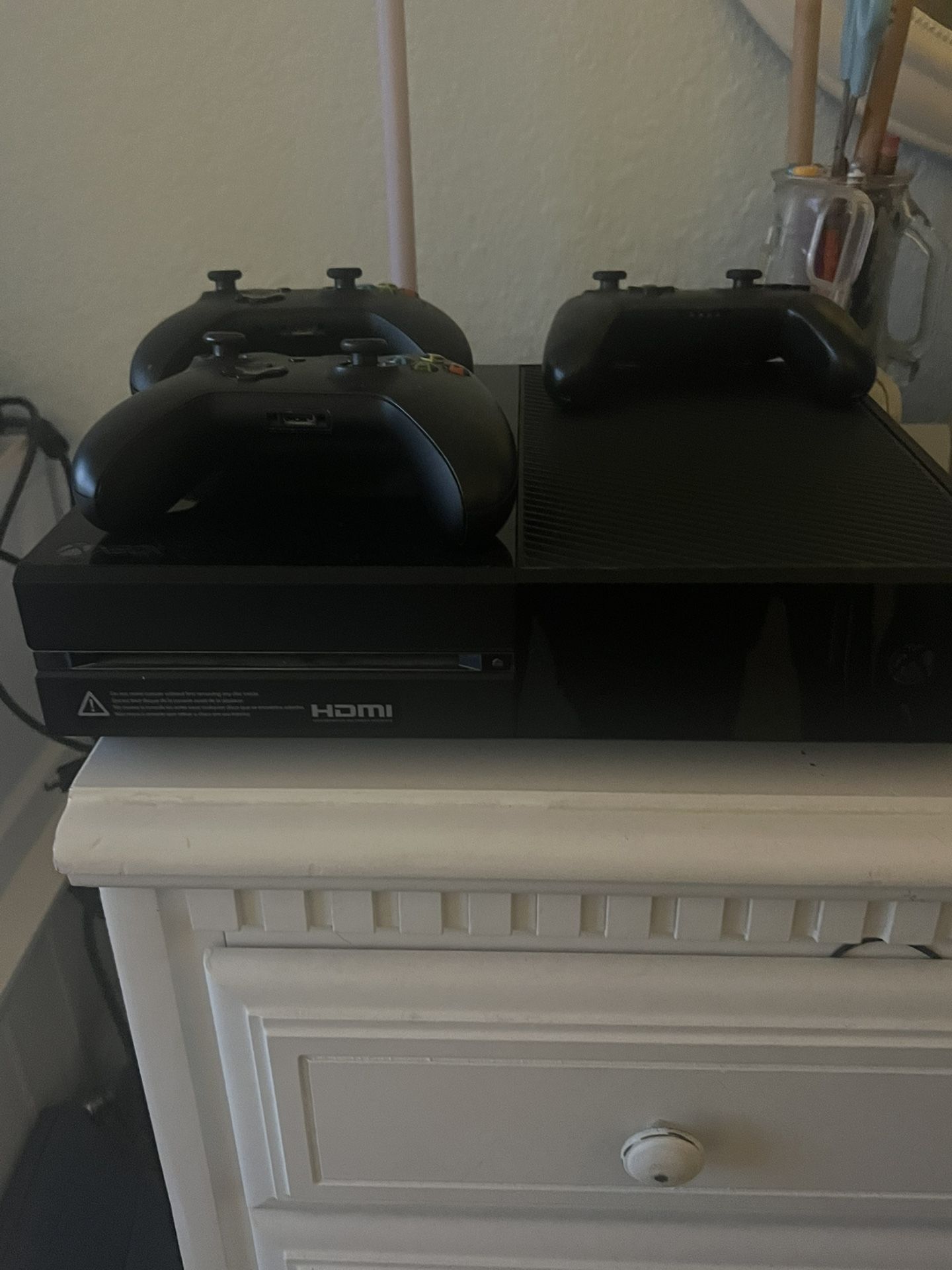 Xbox one, emerge, gaming chair, and three controllers