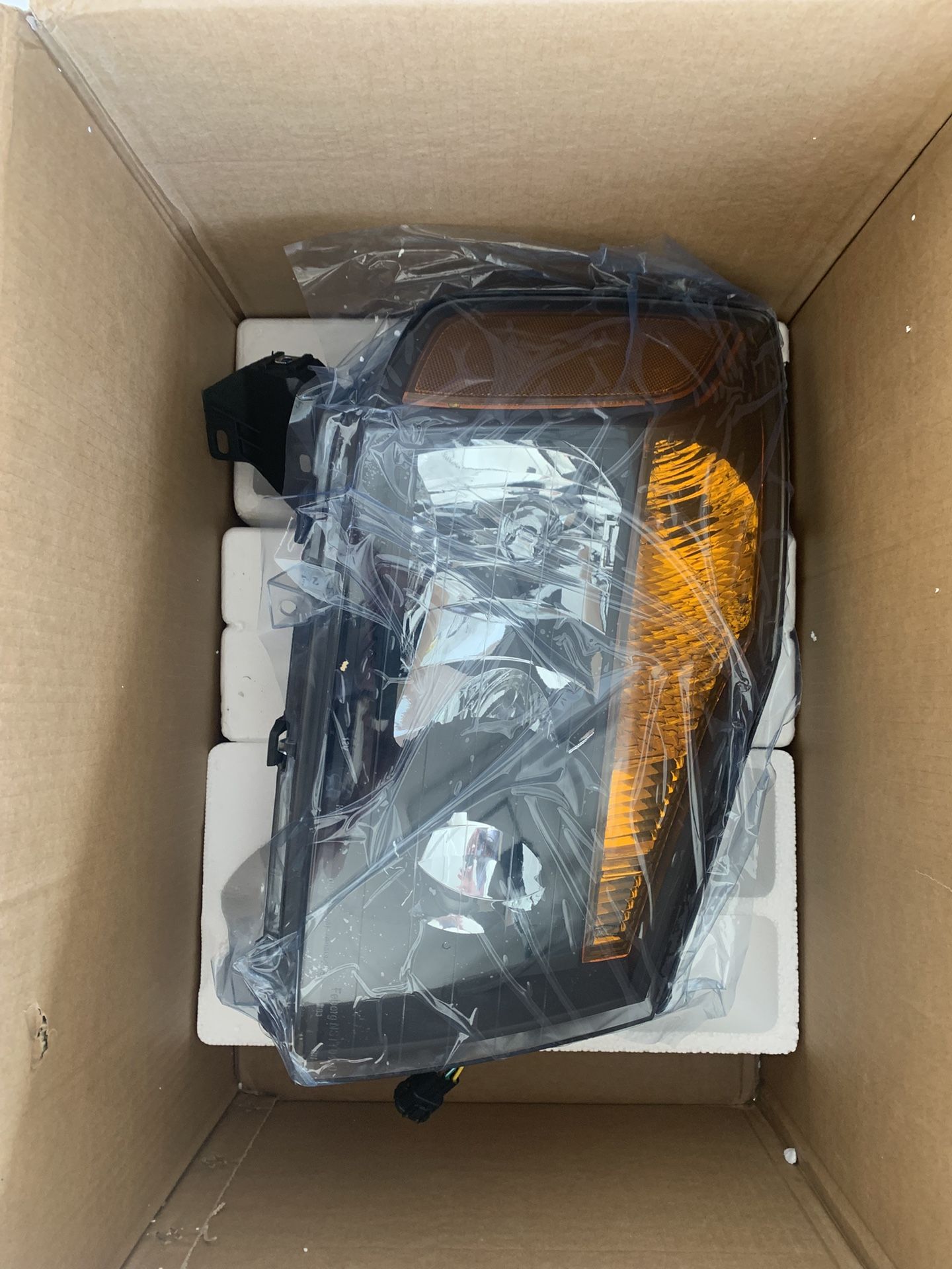 Black Nissan Titan Headlight Passenger Side