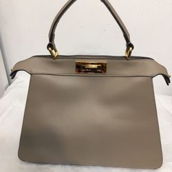 Fendi PeeKaboo Leather Elegant Beige Handbag. Dimensions 3.5x9.5x12. Brand new without Tag and missing crossbody strap.  This elegant beige handbag is