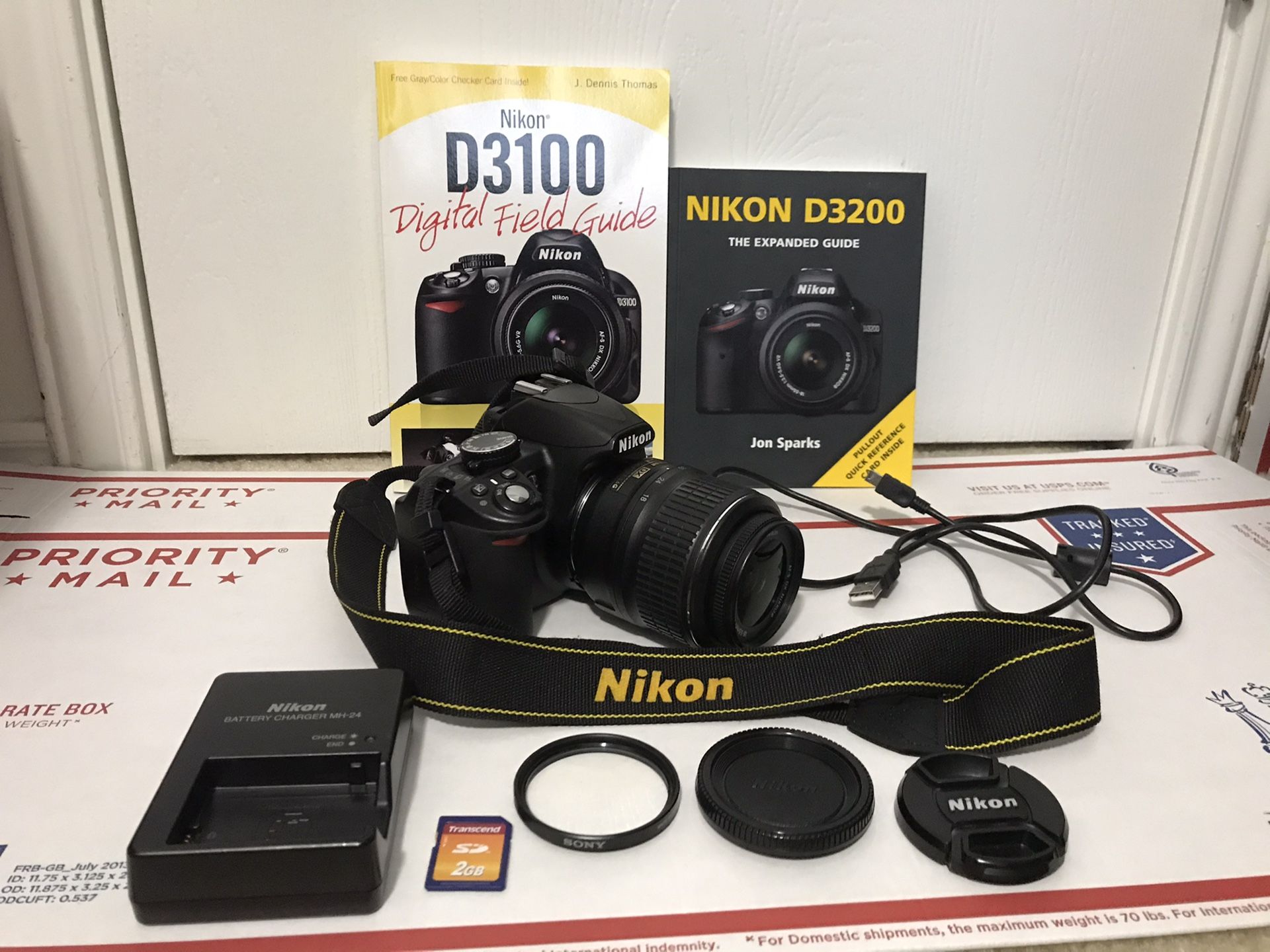 Nikon D3100 14.2MP Digital SLR Camera - Black (With AF-S DX VR 18-55mm Lens) 15,732 shutter count & 9 accessories
