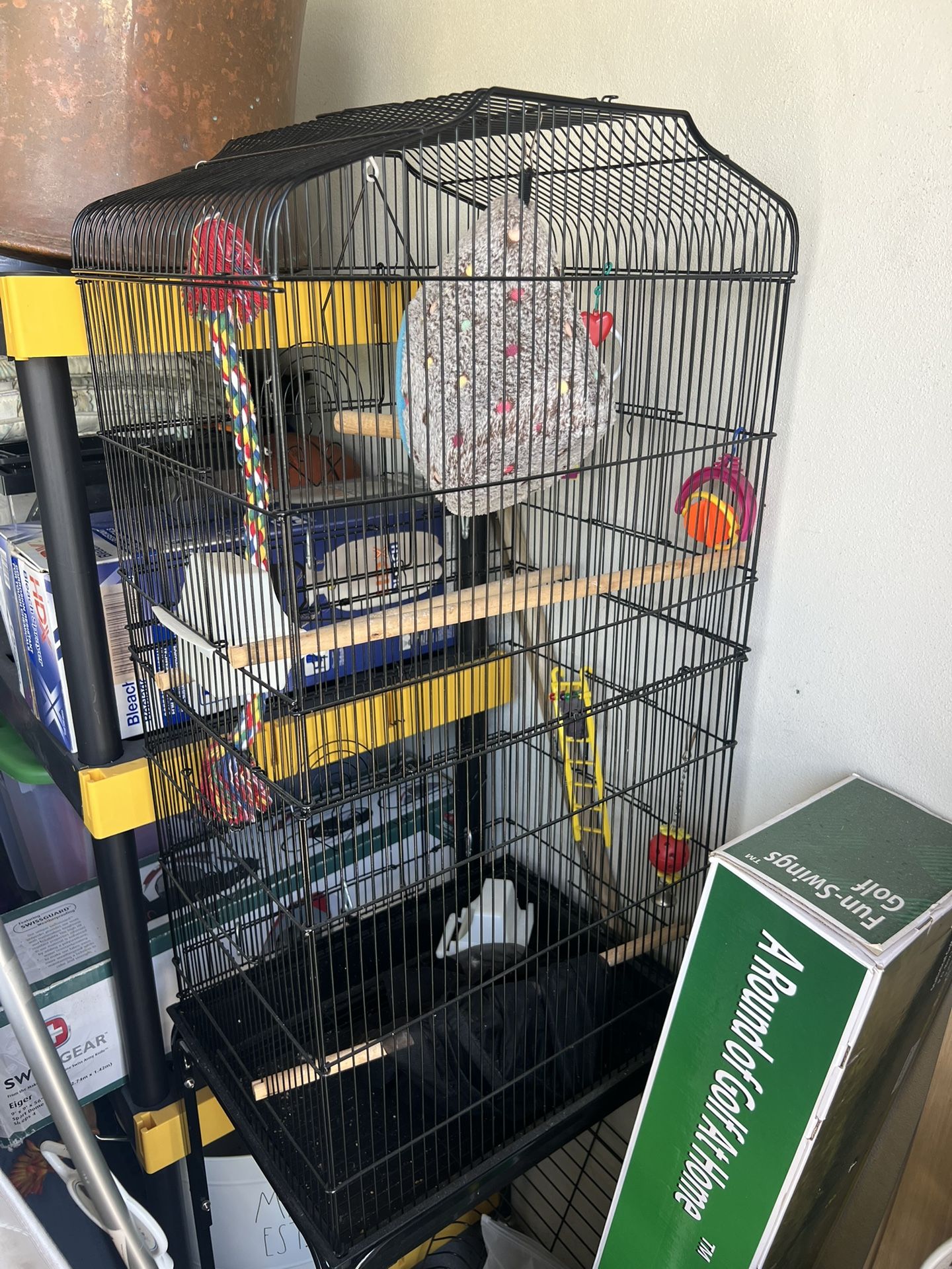 Metal bird cage with stand, accessories, toys parakeet or cockatiel. Kept inside, barely used