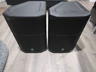 2  jbl prx 615m powered  speakers an power Cords....