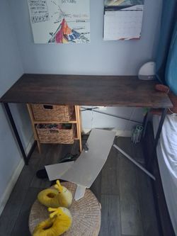Brown desk with black metal legs