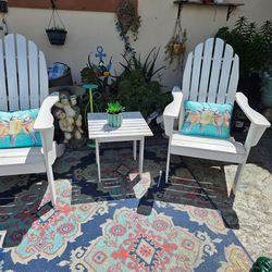 A set of 2 adirondack chairs plus table abd pillow