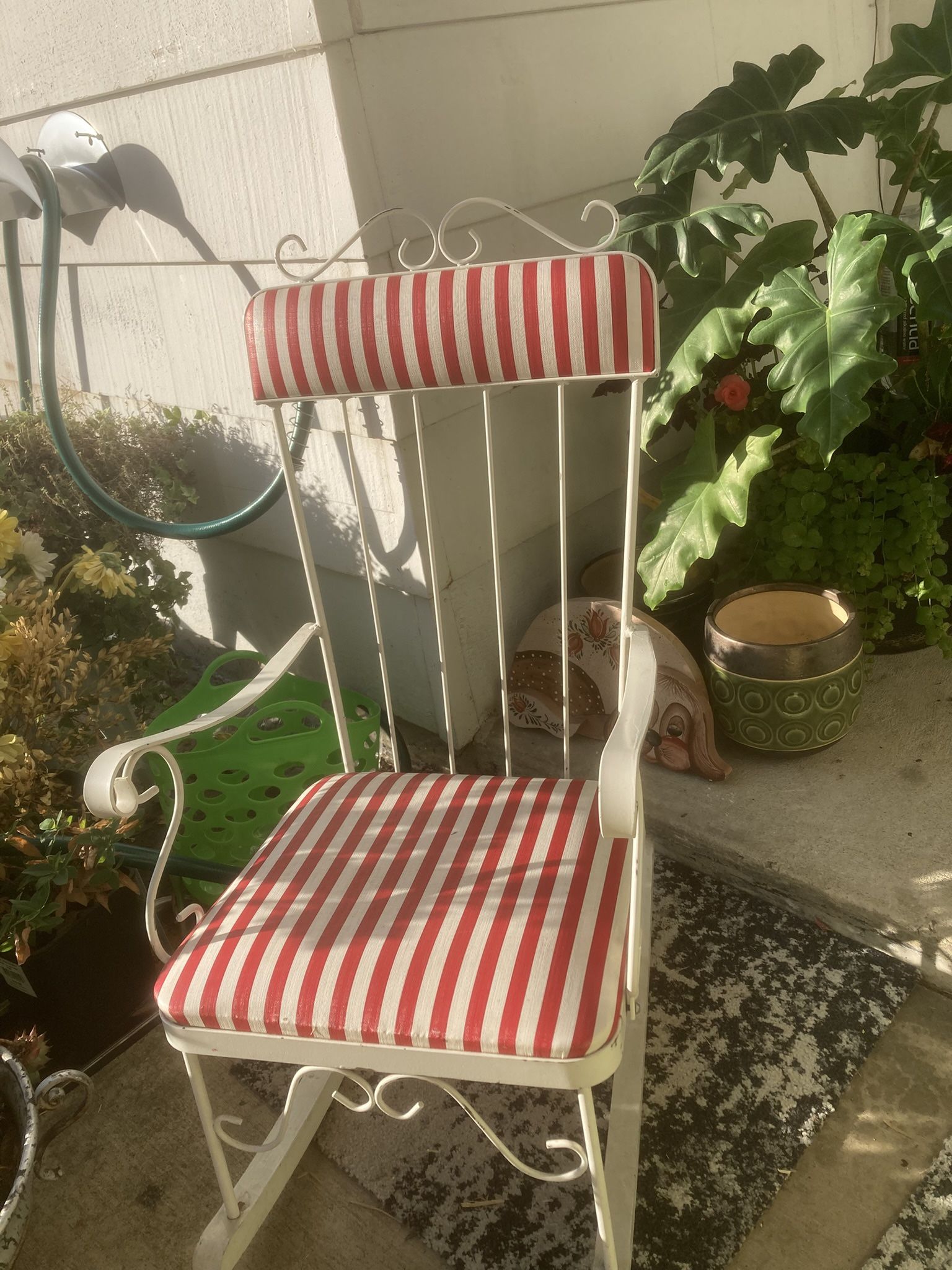 Childs White metal rocking chair with red and white striped cushions. 1950’s