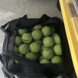 bag of brand new tennis balls