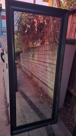 Long wood framed mirror , dark brown. Good quality