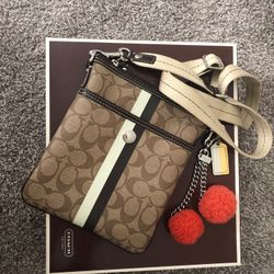 Coach crossbody with pompom bag/keychain