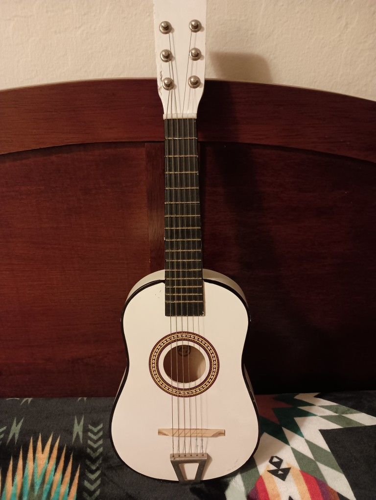 Small White Acoustic Guitar.