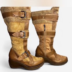 Y2K Tan and brown knee-high Eskimo boots with buckle detail. Shoes are intact but will need a little glue on the edge shown in the last photo