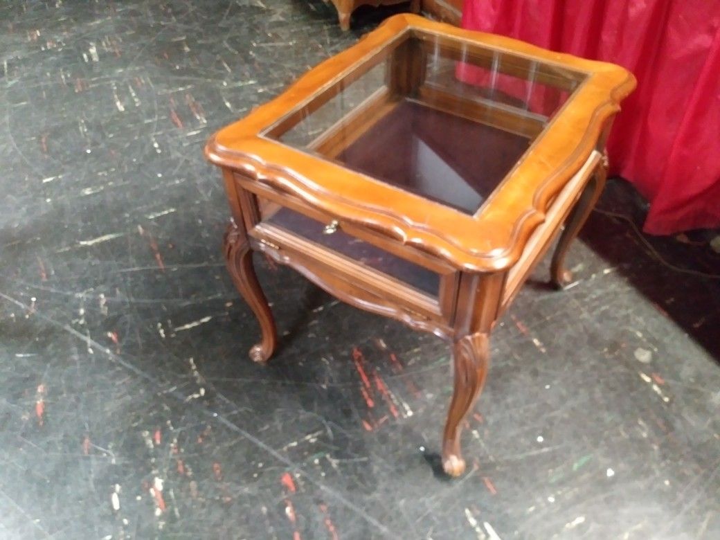 Glass top end table with storage display for sale