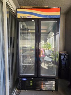 Bottom mount glass door refrigerator
