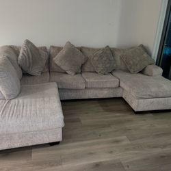 Sectional Sofa  Light Beige Color With Pillows  By Ashley Furniture