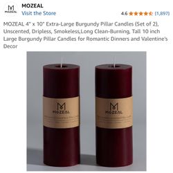 New in box pair of Mozeal Hand Poured Candles 4in x 10in Burgundy