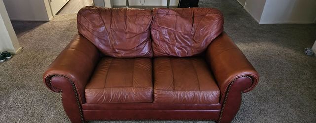 Brown leather loveseat / couch
