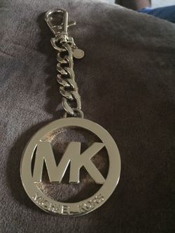 New Mk charm fob key w/o box . Gold