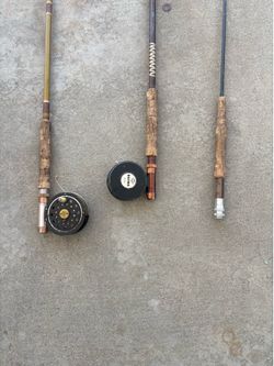 3 fly fishing poles and 2 reels
