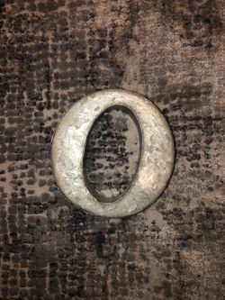 Rustic metal letter “O”